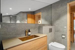 a bathroom with a sink and a toilet at 2314-Stege-Ulvshale-Cedervej-4-B in Tyrholm +15 photos
