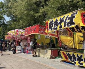 a group of people walking around a food stand at -Park Higashiueno301- 4-minute walk from Ueno Station in Tokyo +34 photos
