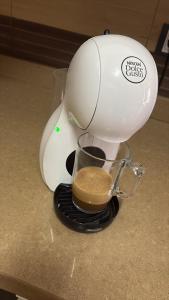 a mixer on a counter with a cup of coffee at Poseidón in Quesada