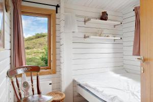 a small room with a window and a chair at OH456-Storvorde-Kystvej-173 in Storvorde