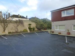 a parking lot in front of a building at Chynoweth Mews in Newquay +3 photos