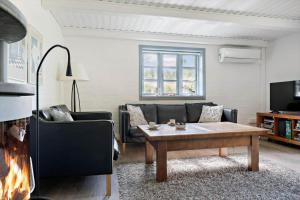 a living room with a couch and a coffee table at 0213-Romo-A-Hveyselsvej-3 in Høm