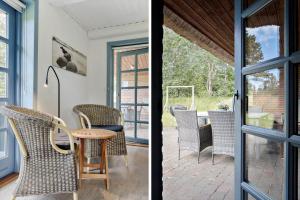 a room with a table and chairs on a patio at 0213-Romo-A-Hveyselsvej-3 in Høm
