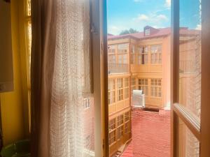 a view of a building from a window at One bedroom apartment in Tbilisi City