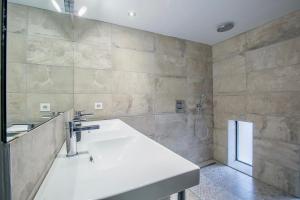 a bathroom with a sink and a shower at Le Venise Factory in Martigues