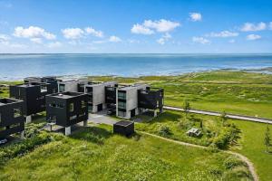 an aerial view of a building near the ocean at 0385-Romo-Hollaenderstraedet-42 in Høm