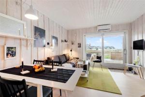 a living room with a table and a couch at 0430-Romo-Vestergade-3-Ap-71 in Høm