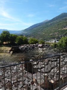 a view of a mountain from a fence at Abri Douillet in Saint Marcel