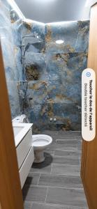 a bathroom with a sink and a toilet in a room at Les 3 perles in Ras El Ma +9 photos
