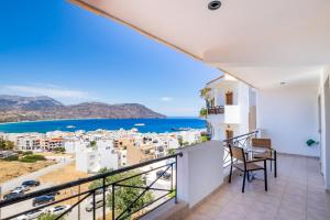 a balcony with a view of the ocean at Fronis Studios in Karpathos