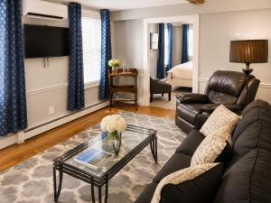 a living room with a couch and a table at Bellevue House in Newport