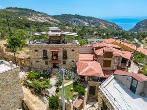 an aerial view of an old house with the ocean at Qekik Boutique Kazdağları in Arıklı