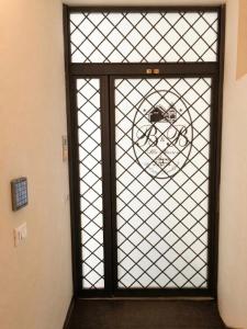 a door with a glass window with a bike on it at B&B Alla Stazione in Palermo