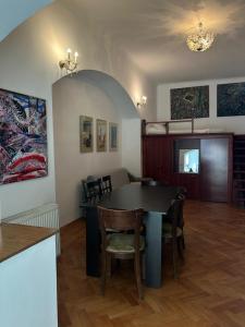 a kitchen and dining room with a table and chairs at Ultra Central Cluj-Napoca in Cluj-Napoca +20 photos