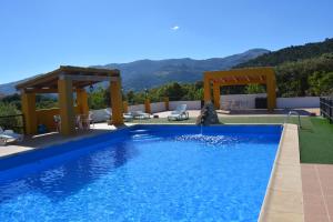 a swimming pool with a view of the mountains at Alojamiento Rural Sierra de Castril in Castril