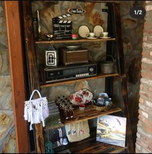 a shelf with a radio and other items on it at Qekik Boutique Kazdağları in Arıklı +47 photos