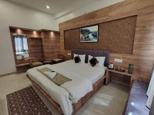 a bedroom with a large bed in a room at Khushi Paying Guest House in Varanasi