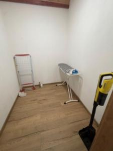 a room with two chairs and a vacuum at Apartament u Anitki in Trzebnica