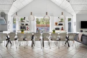 a dining room with a table and chairs at 0498-Romo-Godthabsvej-29 in Høm