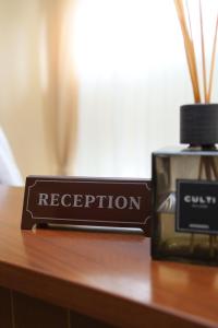 a container of regeneration sitting on a table next to a bottle of perfume at Belveder in Rohatyn