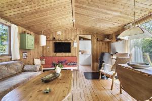 a living room with a couch and a table at 13318-Asnaes-Lindevej-10 in Asnæs