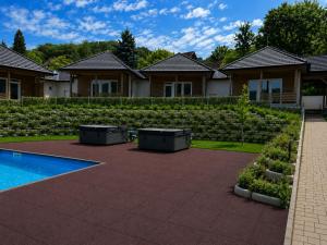a house with a garden with a swimming pool at V44 Resort in Visegrád