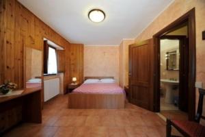 Posteľ alebo postele v izbe v ubytovaní Albergo Pensione Paola