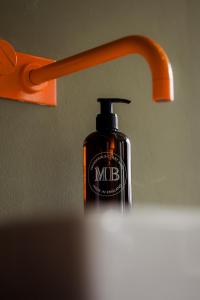 a bottle of mdb under a bathroom sink at ALPAMI Boutique Glockenbach in Munich