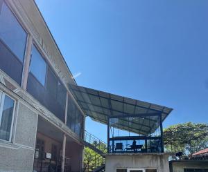 an external view of a building with a balcony at Bato's Vacation House in Gonio