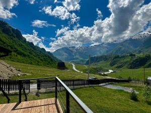 a view of a valley with mountains in the background at Uno Cottage Kazbegi in Kazbegi