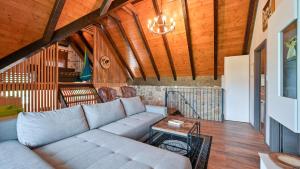 a living room with a couch and a table at Villa Exclusive by Villas Guide in Lepoglava