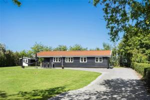 a large house with a large yard in front of it at LF609-Hurup-Thy-Bakkesiden-9 in Doverodde