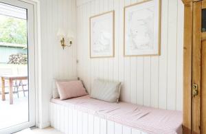 a bench in a room with two pillows on it at 13365-Asnaes-Radyrvej-63 in Asnæs