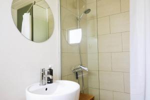 a bathroom with a sink and a mirror at 13365-Asnaes-Radyrvej-63 in Asnæs +21 photos