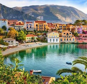 a town with a body of water with buildings at ELENA SEAVIEW house in Argostoli
