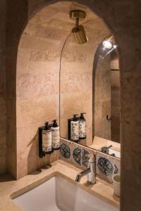 a bathroom with a sink and a mirror at Pendoa Sintra Collection-Soft Opening in Sintra +110 photos