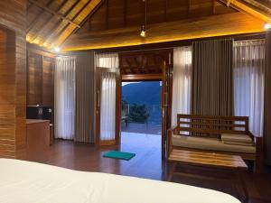a bedroom with a bed and a view of a mountain at Bukit Kembang Sari in Bugbug +72 photos