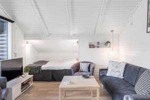 a living room with a couch and a bed at 13338-Asnaes-Hogevej-22 in Asnæs