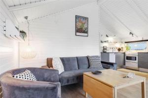a living room with a couch and a table at 13338-Asnaes-Hogevej-22 in Asnæs