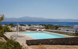 a swimming pool with a view of the water at Villa Kohyli by Mediterà in Isterni