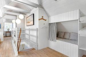 a room with white walls and a bunk bed at 0025-Romo-P-J-Manosvej-18 in Høm