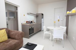 Kuchyň nebo kuchyňský kout v ubytování The Hampton Exclusive Guesthouse