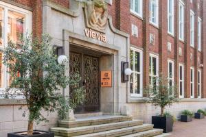a welcome sign on the front of a building at Vie Via - Your Hotel in Leeuwarden