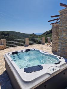 a jacuzzi tub sitting on a patio at Robinson Hideaway Korčula in Korčula