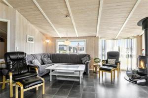a living room with a couch and chairs and a table at LF550-Vestervig-Ingersvej-20 in Vestervig