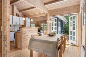 a kitchen and dining room with a table and chairs at LF16183-Logstor-Monasvej-1 in Løgstør +21 photos