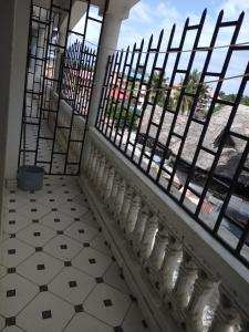 a room with a balcony with a view of the street at Cossy Homes in Mtwapa