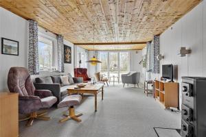 a living room with a couch and a table at LF14221-Roslev-Astrup-Vig-81 in Roslev