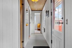 a hallway with white walls and a wooden ceiling at LF14221-Roslev-Astrup-Vig-81 in Roslev