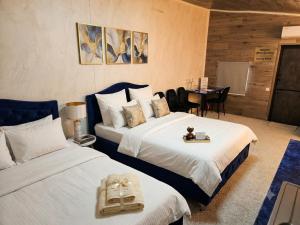 a hotel room with two beds and a table at 31 August 1989 N 59 Hotel apart in Chişinău